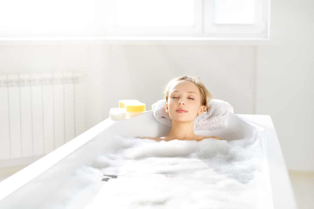 woman soaking in a tub relaxing